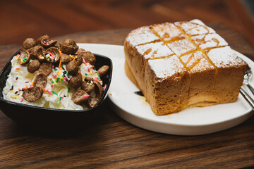 milk shaved ice decorated with chocolate cornflakes serve with vanilla bread toast