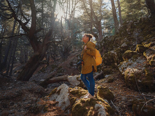 caucasian woman enjoys being in nature,