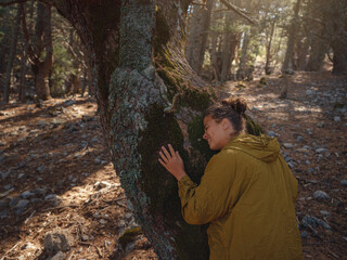 caucasian woman enjoys being in nature,