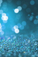 Shiny background. Beautiful glowing bokeh. Bright glowing background. Shiny glowing effect. blue glitter