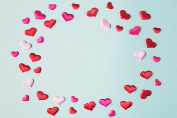 Valentine’s hearts on blue background with copy space. Valentines day greeting card template