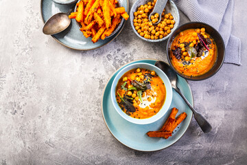 Carrot and sweet potato soup with chickpeas and fresh winter herbs