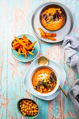 Carrot and sweet potato soup with chickpeas and fresh winter herbs
