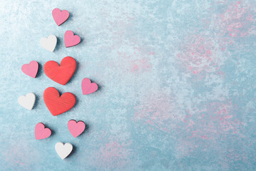 Valentine’s hearts on blue stone background with copy space. Valentines day greeting card template