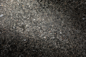 Gray textured cement wall background with fine concrete chips. Construction backgrounds