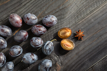 fruit prunes on a dark wooden background with a place to copy, the concept of harvesting