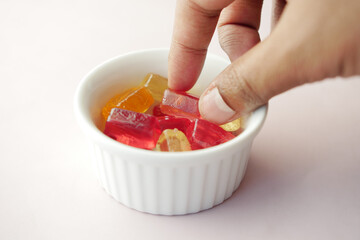 hand pick colorful sweet candy 