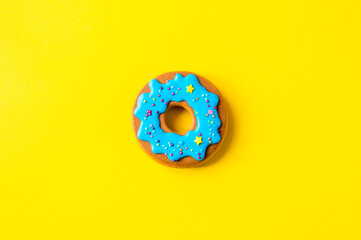 gingerbread in the form of a donut on a yellow background. High quality photo. Flatlay