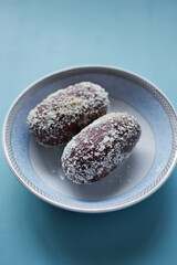 close up of indian sweet in a bowl on table.