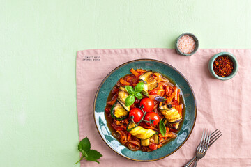 Zucchini pasta in red sauce. Sauteed Vegetables. Zucchini, carrot, onion, garlic and tomatoes.