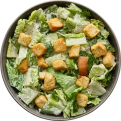 Deurstickers Caesar salad top down view in rustic bowl isolated © Joshua Resnick