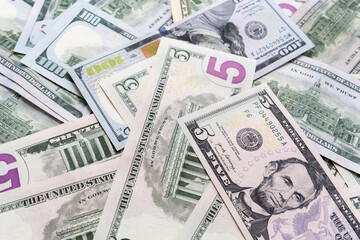 Background from different banknotes of dollars and euros.