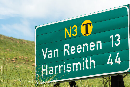 N3 national toll road or highway sign or signage with names Van Reenen and Harrismith and kilometres still to go concept travel and tourism in South Africa