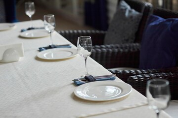 Crystal glasses for celebration, decorated for the holiday. Table setting.