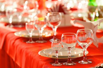 Crystal glasses for celebration, decorated for the holiday. Table setting.