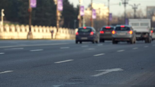 Morning rush hour traffic. 4K video with cars in blurred background (selective focus) on a boulevard from Bucharest. Transportation industry video.