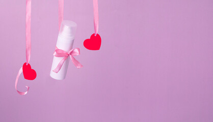 Flying red paper heart on pink background. Valentine's Day. Symbol of love. Copy space.