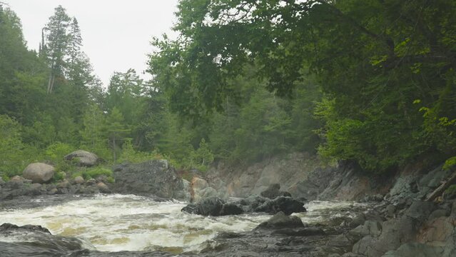 The Batchawana river flows over some rapids toward the falls.  Shot in 4K