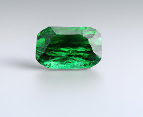 Close up of emerald on white background created using generative ai technology