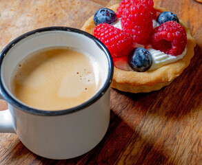 Freshly baked baskets with curd cream  and strawberries 
