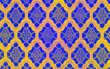 Ceramic tile with oriental pattern in blue and yellow color combination.
