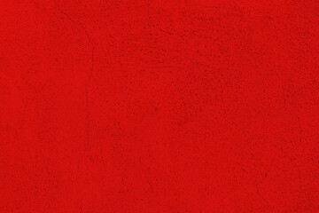 Fototapeta premium Red abstract background, plaster texture, old painted facade of the building, with a crack. 