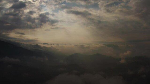 Dark clouds on sky.
Drone aerial view. 
Mountains. 