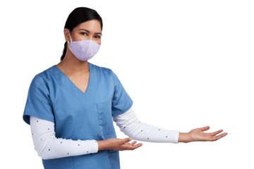 Young doctor wearing a surgical face mask and gesturing to her left Isolated on a PNG background.