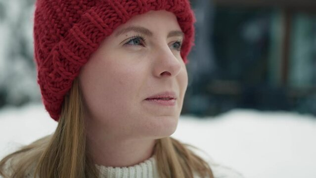Close up of woman standing outdoors and enjoying the winter. Shot with RED helium camera in 8K.     