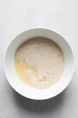 Activated yeast with water and melted butter, dry yeast granules on water, foamy yeast