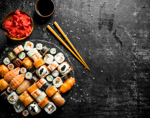 Fresh sushi rolls with vegetables, shrimp and salmon.