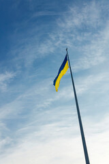 The symbol of Ukraine. Flag of Ukraine. Flag waving in the big city. Capital of Ukraine 