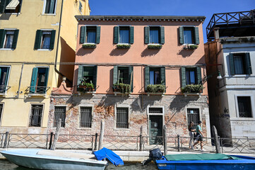 Fototapeta na wymiar Venice, Italy: Historical buildings along the river canal. Popular tourist destination.
