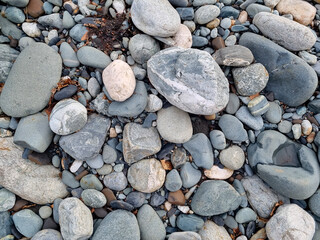 water-sharpened stones on the bank of a mountain river. natural building material for landscape design in the park.