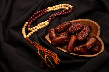 Ramadan food Sweets mixed of dried fruits, Dates premium dates, 
full of date fruits, Arabic coffee, Concept: month fasting culture Muslim prayer, 
1444 Puasa Ramadan Kareem greeting festival
