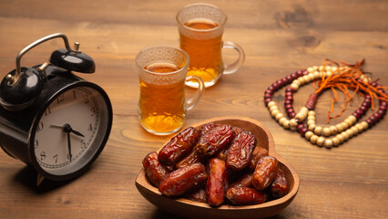 Ramadan food Sweets mixed of dried fruits, Dates premium dates, 
full of date fruits, Arabic coffee, Concept: month fasting culture Muslim prayer, 
1444 Puasa Ramadan Kareem greeting festival
