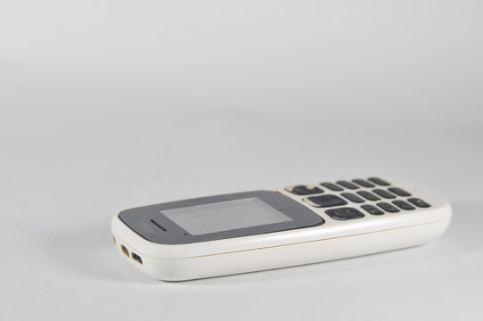 old gsm mobile phone on white background