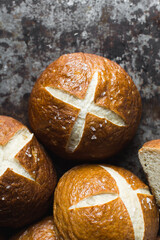 Pretzel buns on a baking sheet, German laugenbroetchen, lye buns on a baking tray