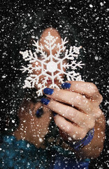 Woman wearing Blue Corset with snowflake ornament and snow storm