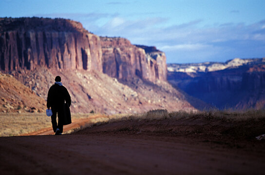 A Man Looking For Boulders To Climb, Indian Creek, Utah.