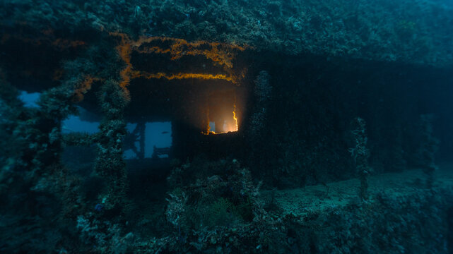 technical diving light inside a room in a ship wreck