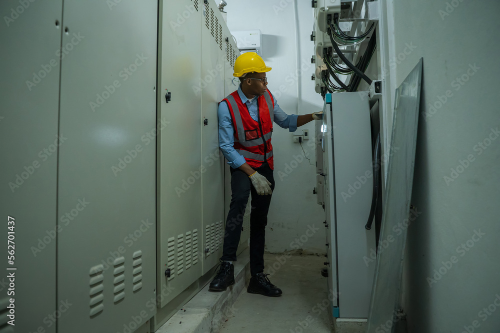 Aufkleber engineer working in electrical control room,operator station network in industry factory,switchgear.