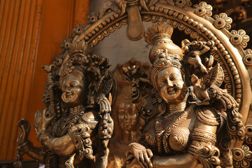 Bronze Radha and Krishna. Hindu deities. Shallow depth of field. Selective focus.