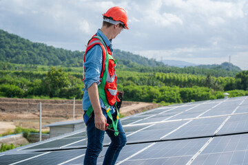 Technician inspection and repair solar cell on the roof of factory,Solar PV Rooftop.