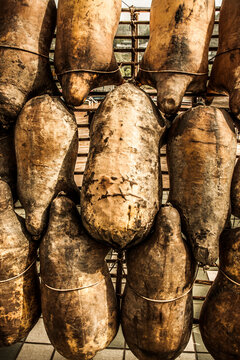 Dried pig skins on a rack.