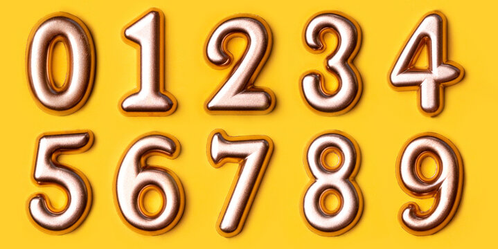 Metal numbers set on a yellow background. Top view.