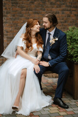 young couple bride and groom in a white dress