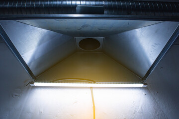 close-up of exhaust hoods in hazardous production, together with an air removal system,...