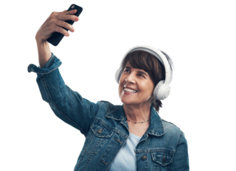A senior woman taking selfies while wearing headphones Isolated on a PNG background.