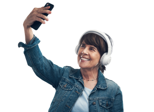 A senior woman taking selfies while wearing headphones Isolated on a PNG background.
